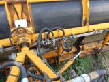 a close up of a machine that is sitting in the grass