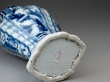 a blue and white vase sitting on a table