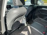the back seats of a car are empty in a parking lot