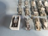 a lot of silver toys that are sitting on a table