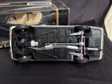 a toy car that is sitting in front of a box