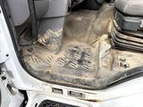 a dirty seat in the back of a car