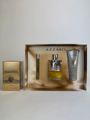 an image of a box containing a bottle of perfume and a tube of lotion