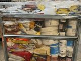 a cart full of food that is sitting in a warehouse