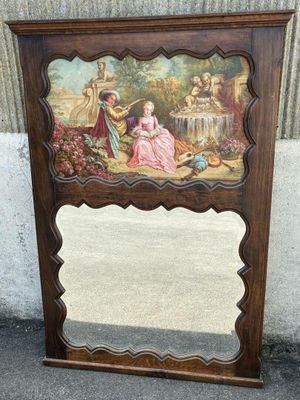 une image représentant un miroir orné d'une peinture, posé par terre