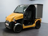 a small yellow vehicle with a black roof and door open