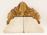 two bookends with a lion head on them