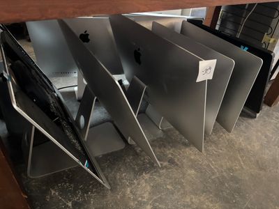 several apple products stacked on top of each other
