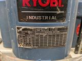 a close up of a blue machine with a sign on it
