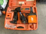 an orange case with tools in it on the floor