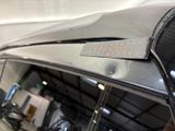 a close up of a car ' s hood with a sticker on it