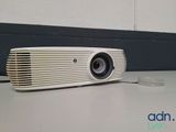 an image of a white projector sitting on top of a table