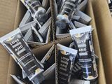 a cardboard box filled with different types of toothpaste