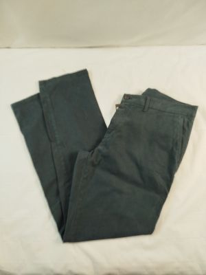 a pair of pants that are laying on a bed