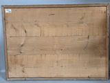 an old wooden box sitting on top of a table next to a wall