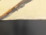 someone is using a pair of scissors to cut a piece of paper