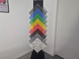 a display of legos on a black stand in a room