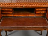 a small desk with a wooden top and drawers