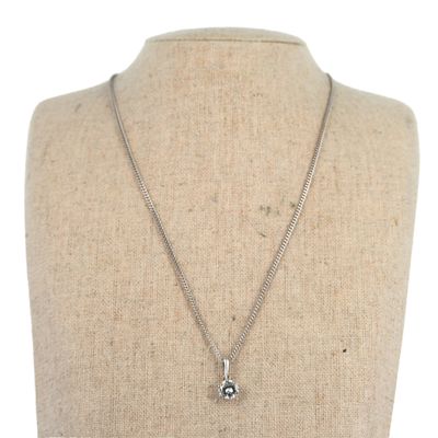 a close up of a necklace on a mannequin mannequin