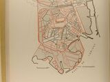 an open book with a drawing of a map of a city