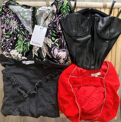 three women ' s bra tops, one black, one red, and one black