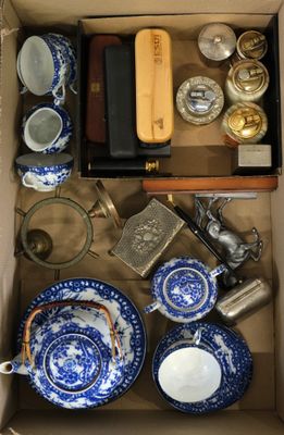 a box full of blue and white dishes and cups
