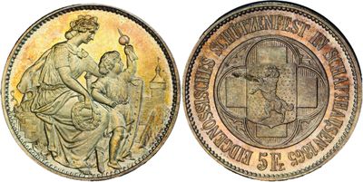 a close up of a coin with a woman and child on it