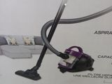 the box of a vacuum cleaner is open on the floor