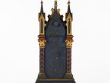 an image of a blue and gold clock sitting on top of a table