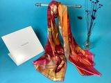 an image of a scarf and a card on a blue background