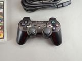 a video game controller and a game card on a table