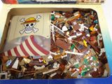 a box full of legos with a pirate ship in it