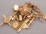 a pile of gold jewelry sitting on a table