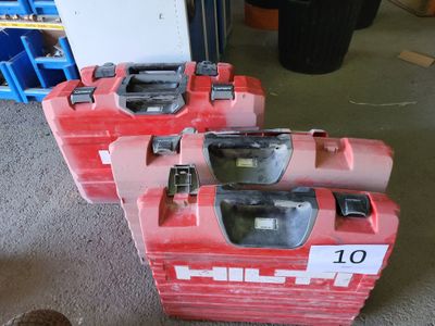 two red boxes with numbers on them sitting on the floor