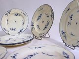 a lot of plates that are sitting on a table