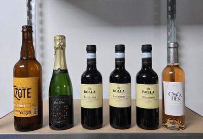bottles of wine are lined up on a shelf in a kitchen