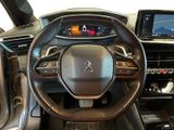 the interior of a car with a steering wheel and dashboard controls