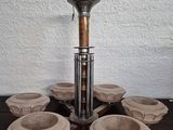 a candle holder that is on a wooden table