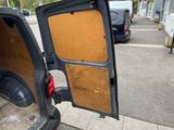 a car with the door open on the side of the road