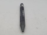 a black pen that is laying on a white surface