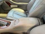 beige interior of a car with leather seats and steering controls