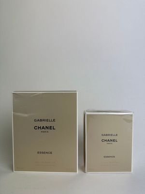 a white box with a bottle of perfume next to it