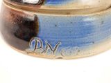 a close up of a bowl with the word dm on it