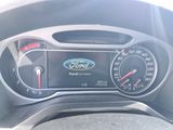 a close up of a car dashboard with a speedometer