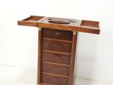 a small wooden table with a mirror on top of it