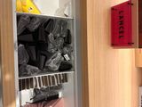 a refrigerator with many items in it in a kitchen