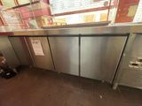 a stainless steel counter in a restaurant with a lot of counter space