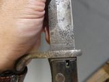 a person holding a knife in their hand