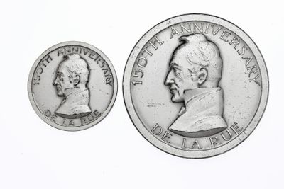 an image of a silver coin with a picture of a man ' s face on it