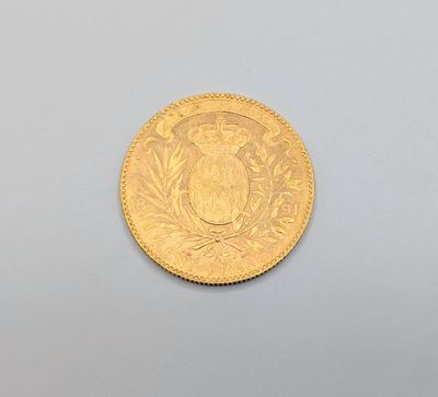 an image of a gold coin sitting on top of a white surface
